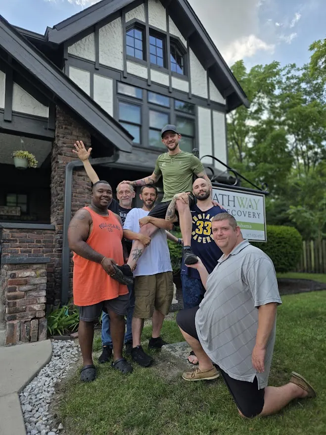 Pathway to Recovery residents and community members together outside a Pathway property